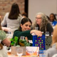 person playing Connect 4 game photo 2